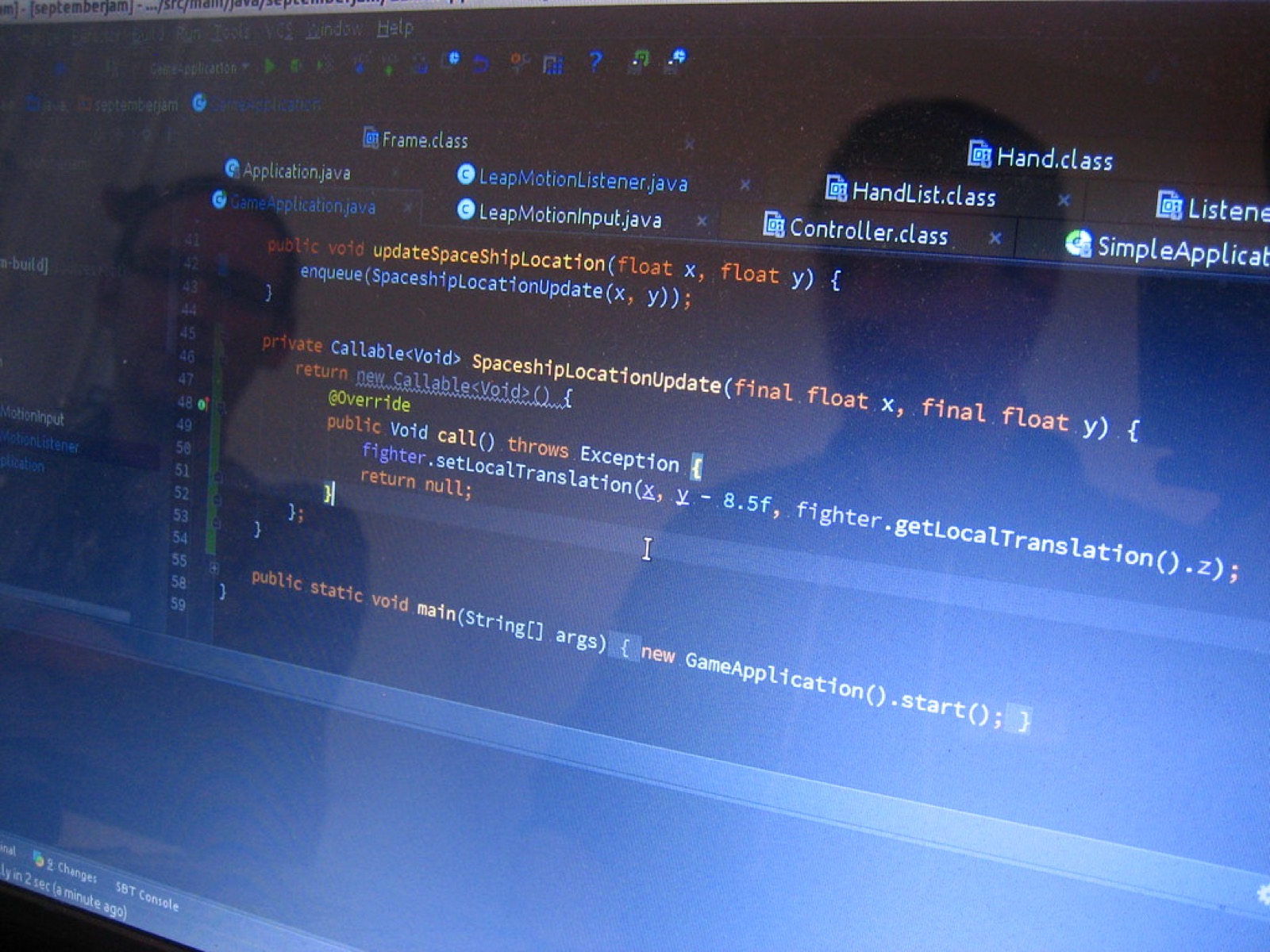 Programmers Reflection on Screen Showing Code